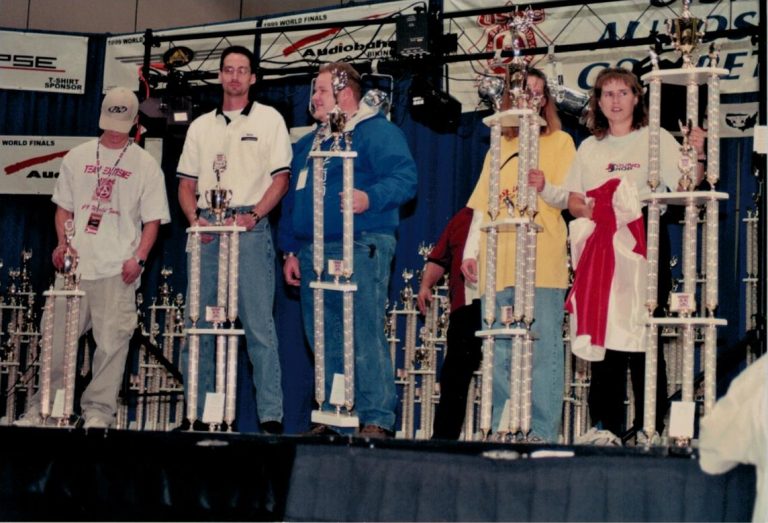 Rick Berry on stage with 4th place trophy