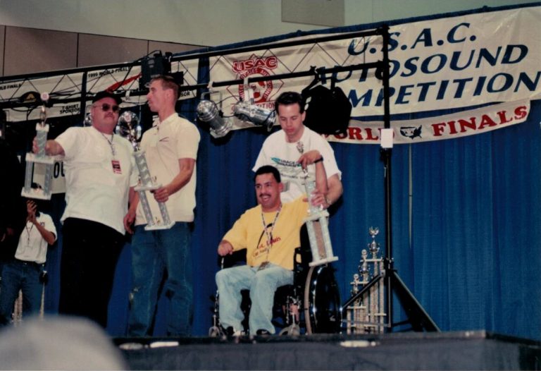Tony on stage with trophy